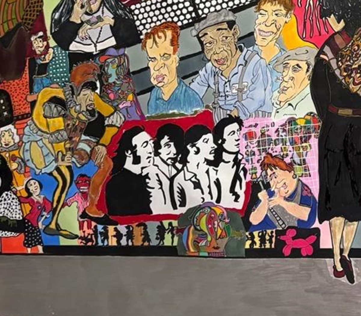 Painting detail with faces and cultural fragments